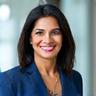 Portrait of Dr. Anita Sharma, a seasoned nutritionist and biochemist, smiling confidently.